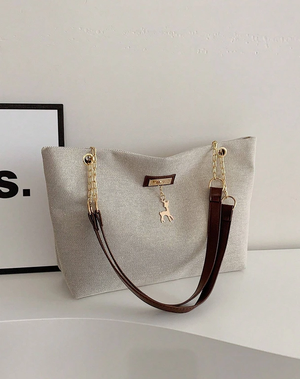 [sg2301218648494228] Bolsa de tote con decoración metálica de ciervo a la moda, de gran capacidad con correa de cadena.