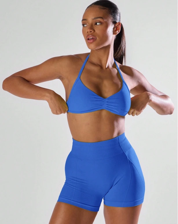 Sujetador deportivo Musera Sport con busto fruncido, espalda abierta y cuello halter