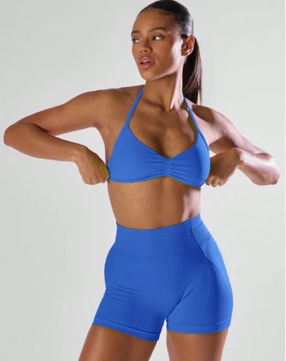 Sujetador deportivo Musera Sport con busto fruncido, espalda abierta y cuello halter
