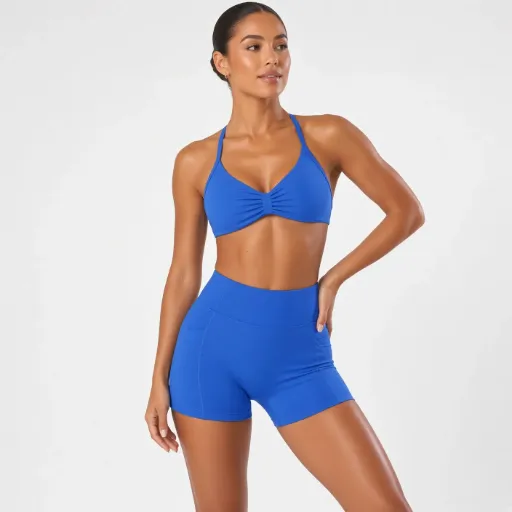 Sujetador deportivo Musera Sport con busto fruncido, espalda abierta y cuello halter