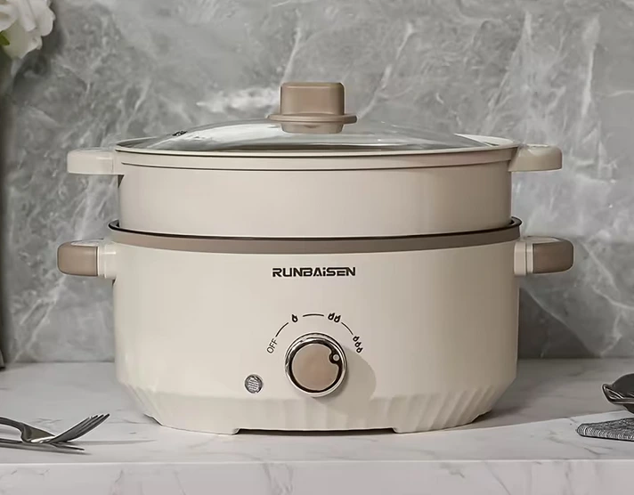 Olla eléctrica multifuncional antiadherente y portátil, con vaporera incluida, de bajo consumo (350-800W) compacta y fácil de limpiar.